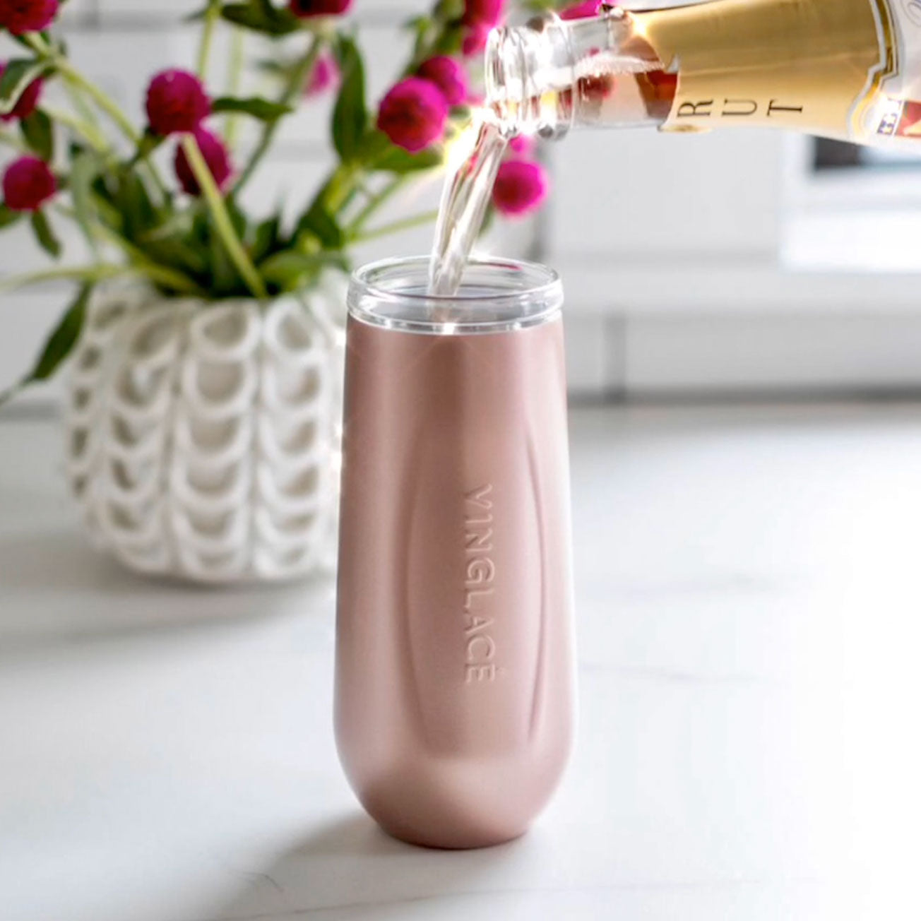 You can now buy insulated champagne flutes with lids